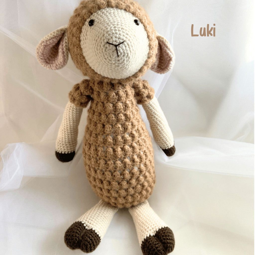 Luki, a Lambies soft toy, a cuddly plush lamb with charming features, designed for comfort and companionship—bringing warmth and joy to little ones and collectors alike.